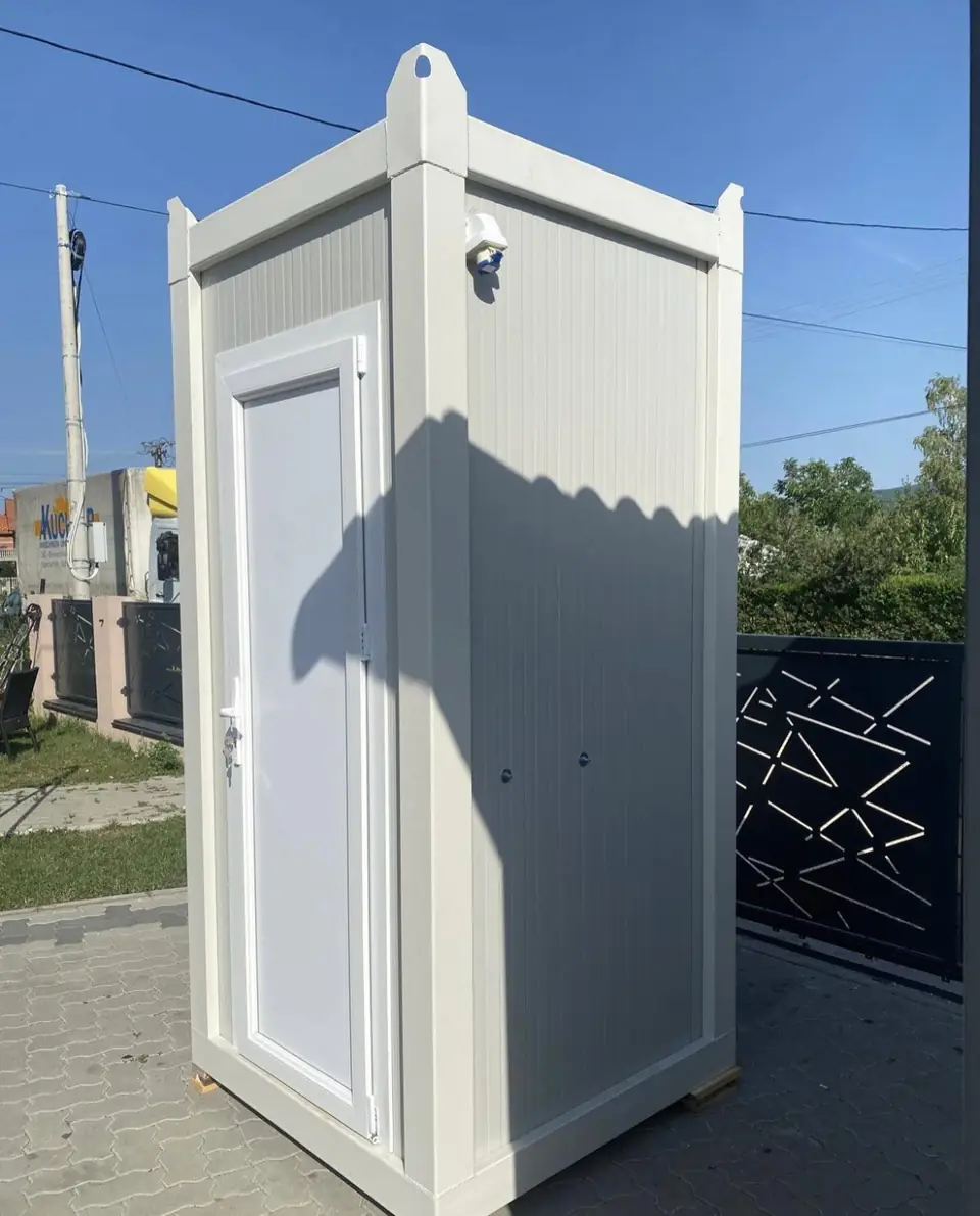 White luxury restroom cabin standing on pavement
